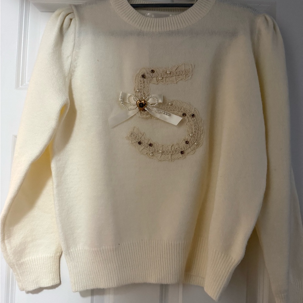 Elegant Cream Sweater with Embellished Detail